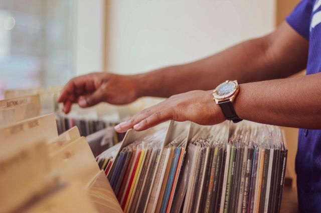 hands searching through records