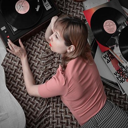 woman listening to records